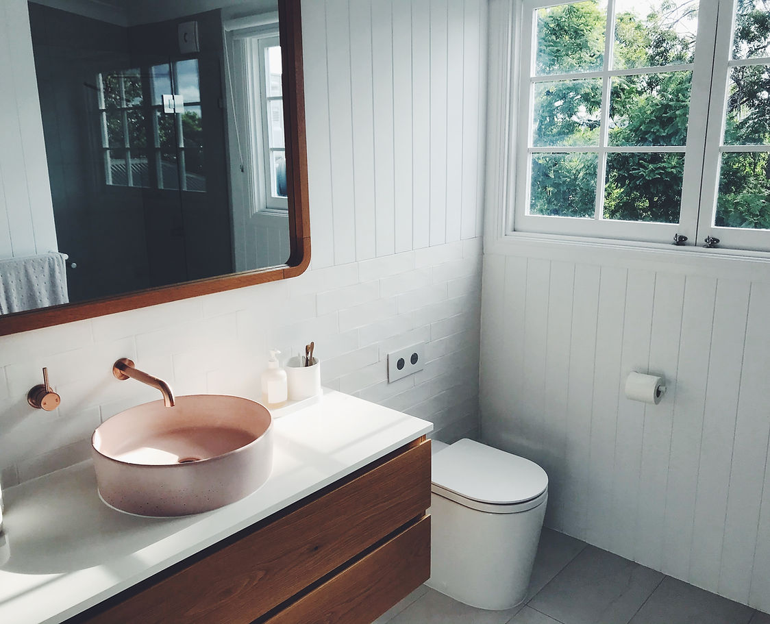contact - a sleek modern bathrom with sink and toilet
